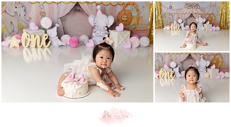 Girly circus themed cake smash with girl smiling and cake on face